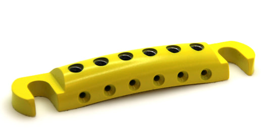 Angled view of yellow cerakote guitar stopbar.