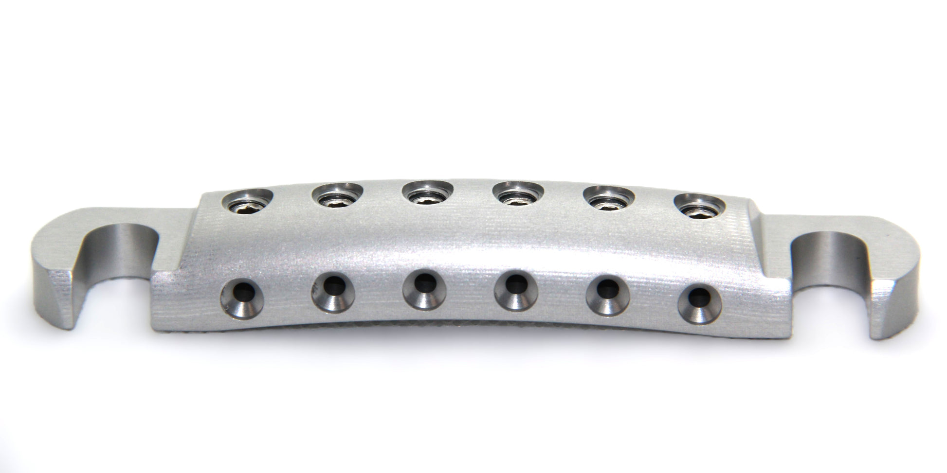 Lightweight aluminum stopbar for inexpensive guitar with clear anodized finish.