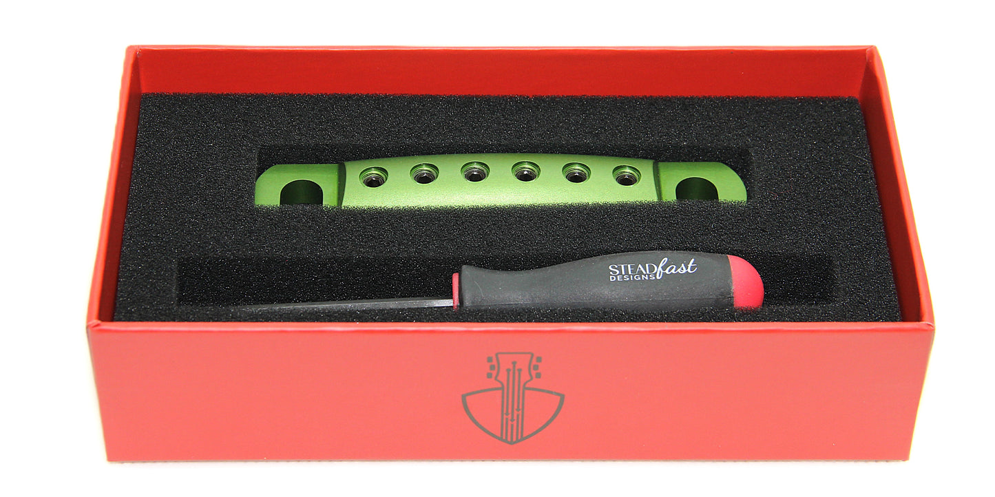 Green stopbar with black screws in box with branded hex tool.