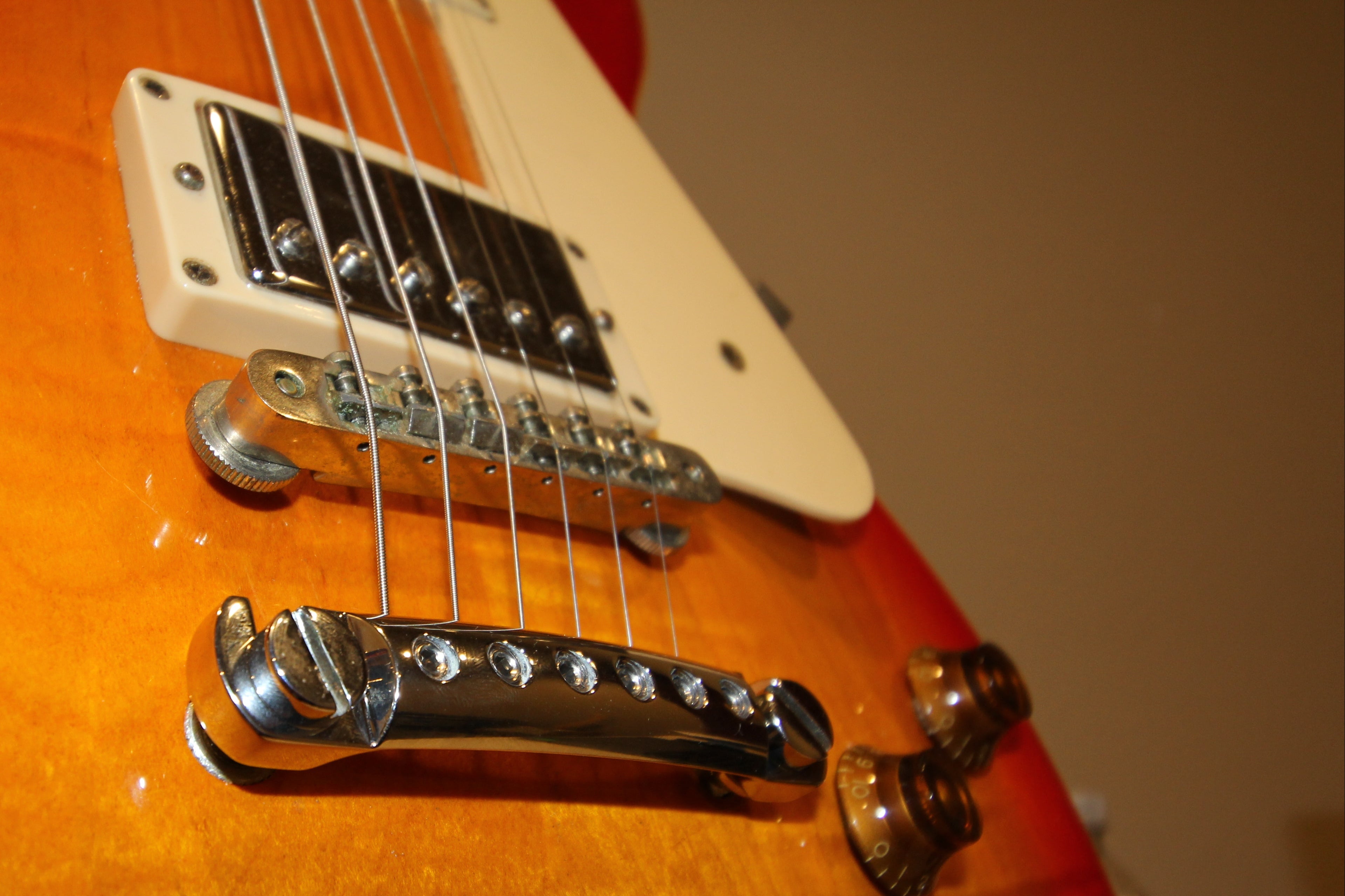 Les Paul guitar upgraded with lightweight aluminum string-locking stopbar.  Tuning is steady, restringing is faster.  Steadfast.